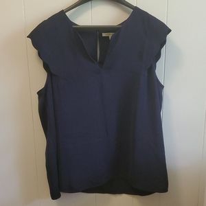 Navy top with scalloped sleeves